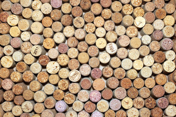 Background of used wine corks. Wall of many different wine corks. Closeup of wine corks.
