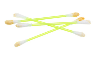 dirty ear sticks on a white background