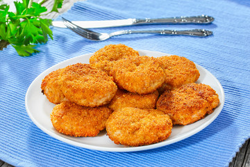 close-up of juicy delicious chicken, pork, beef breaded cutlets