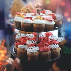 Dessert table for a party. Ombre cake, cupcakes