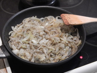 frying pan on a cooker full of onion