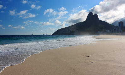 Afternoon at Ipanema beach, Rio de Janeiro, Brazil. The sea, the beach, the blue sky with clouds...