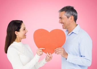 Fototapeta na wymiar Romantic couple holding heart shape