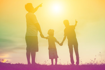 silhouette of a happy family and happy time sunset