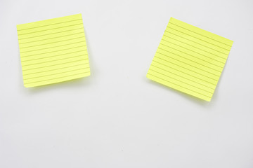Yellow post its on white background