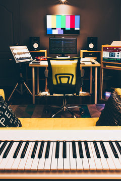 white electric piano in digital sound studio, film editing, production house