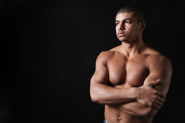 Fototapeta premium Thoughtful young african sportsman posing