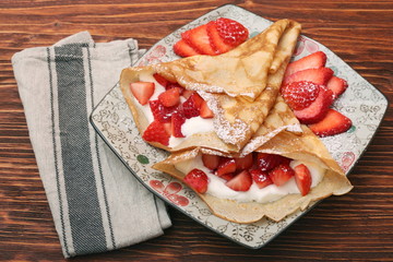 fresh crepes with strawberries and yogurt