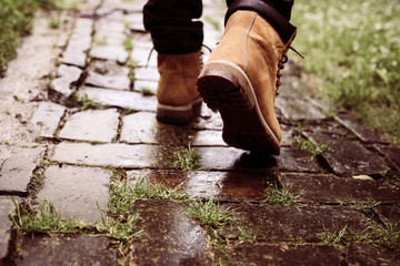 Businessman sprinting along street, rear view.