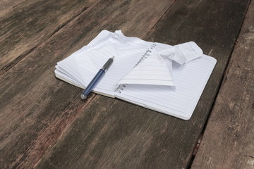 notebook crumpled paper wrinkled blank  white  on the desk, busi