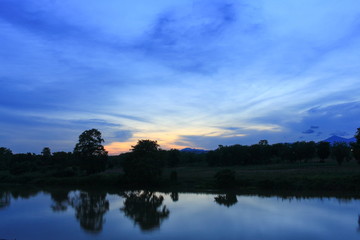 sunset colorful and silhouette woodland  twilight with river