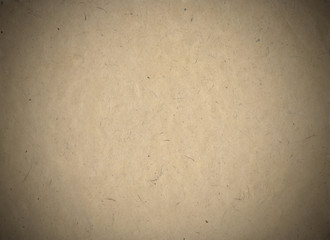 Grungy poster board, raw mock up, visible fibers, with vignette. Neutral authentic background surface, sand tone. Template for your design.