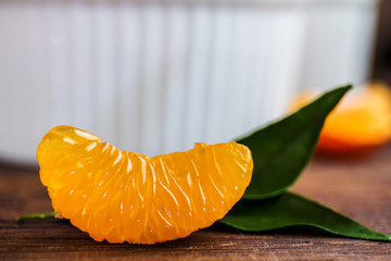 Mandarins Tangerines Slice with leaves Closeup