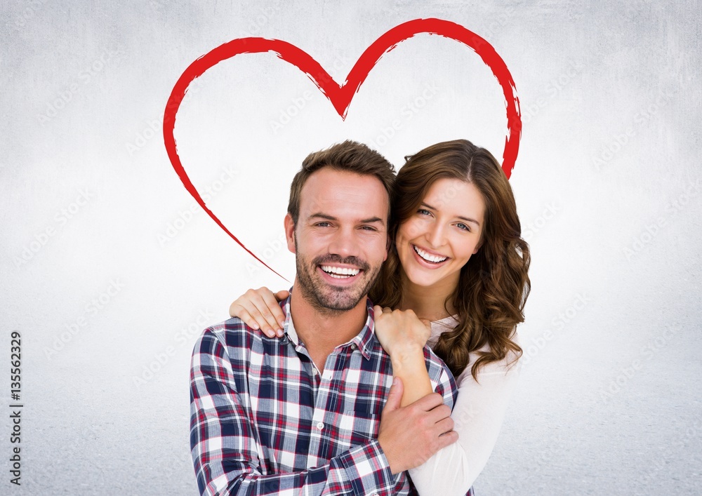 Wall mural Portrait of happy couple embracing 