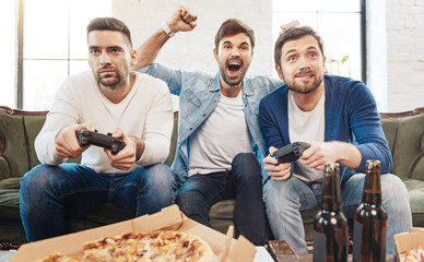 Nice good looking men playing video games