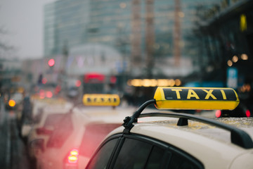 Generic yellow taxi sign on car roof in Germany