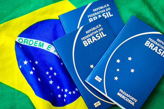 Brazilian Passport on Brazilian flag background
