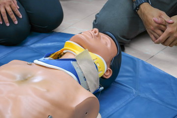 medical dummy on CPR, in emergency refresher training to assist