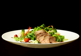 Green salad with baked meat