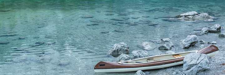 Canoe on calm blue lake, Aibsee, Germany