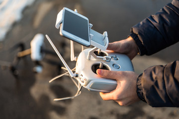 Man with remote control prepare white drone digital camera for start flying in winter © F8  \ Suport Ukraine