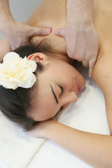 Obraz na płótnie Canvas Woman enjoying a massage treatment
