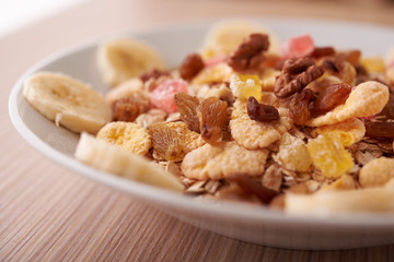 flakes with dried fruit, granola on the plate
