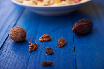 flakes with dried fruit, granola on the plate