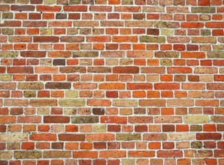 Retro red brick wall of an old house