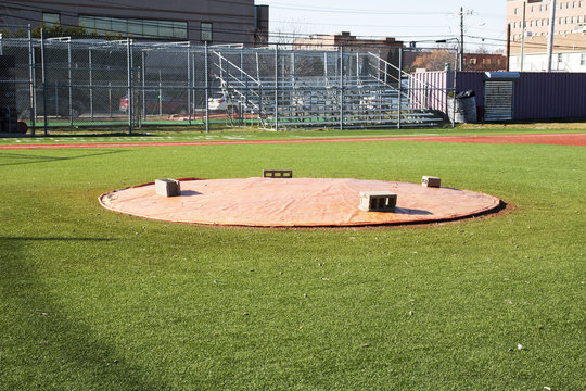 Pitchers mound covered with a tarp