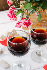 Two wine glasses with heart and letters Love