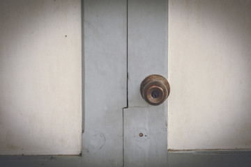 metal handle on a old wooden door