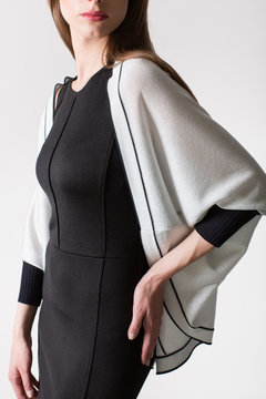 Details of women's clothing. Detail dress on a model on a white background