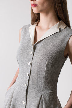 Details of women's clothing. Detail dress on a model on a white background