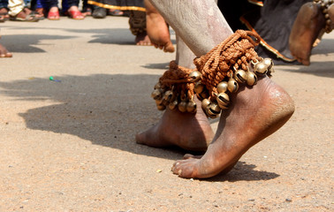 Closeup of bells tied to legs a tradition of Indian gond tribals performing Ghussadi dance, associated with farming to pray goddess with tribal music