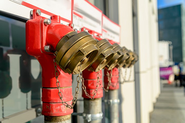 Red fire hydrants in the street. Shallow depth of field.