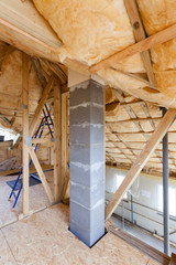 Iinsulation of attic with fiberglass cold barrier and insulation material