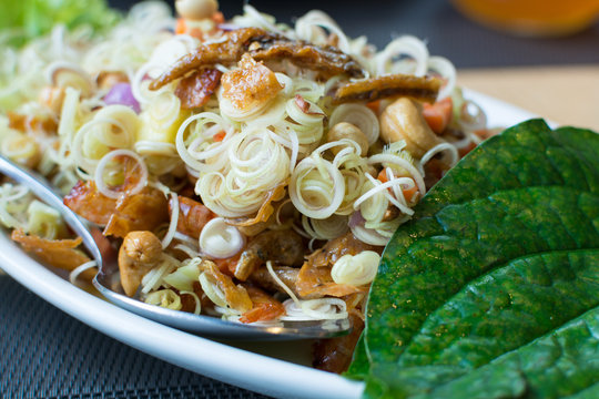 Spicy lemongrass salads with chaplo leaves on the dish