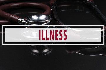 Obraz premium Stethoscope on black background with text ILLNESS