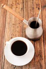 A Turkish coffee set with Cezve on wooden table