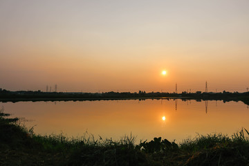 Fototapeta na wymiar sunset at the waste water treatment sump