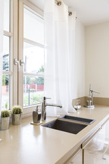 Fototapeta na wymiar Kitchen worktop with amenities and sinks