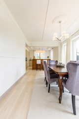 Bright dining room with modern kitchen