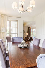 Wooden dining table with comfy chairs