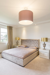 Cosy bedroom with golden amenities