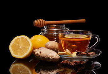Honey and tea with spices and lemon.