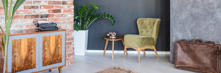 Apartment with green armchair
