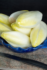 Fresh and healthy Chicory (witloof) Salad on a plate. Dietary meal.