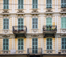 Fototapeta premium Beautiful old facade with shutters on the windows. Italy.