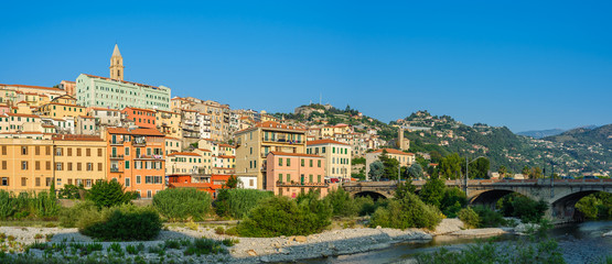 Fototapeta premium Colorful houses under blue sky in old town of Ventimiglia, Italy.